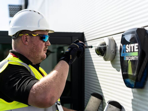 4Site technician inspecting alarm
